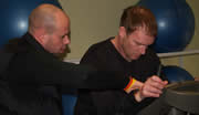 Chris instructing new boy to the sport Andy Lett - how to use the upright bike ... !!!!!