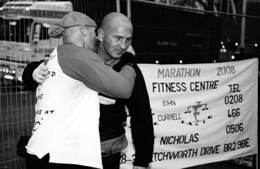 Giving John a big hug. After all that training together , we had done it.